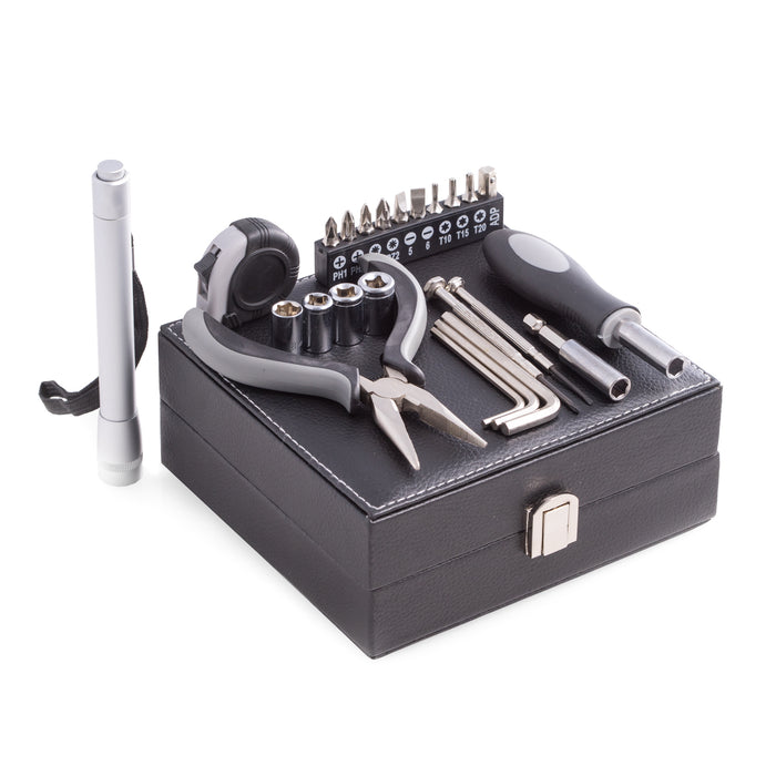 Occasion Gallery 25 pc. Tool Set in Black Leatherette Case. Includes Flash Light, Hex Keys, Screwdriver Set, Socket Set, Socket Adaptor, Measuring Tape, Long Nose Pliers, and more.  5.75 L x 6 W x 2.5 H in.