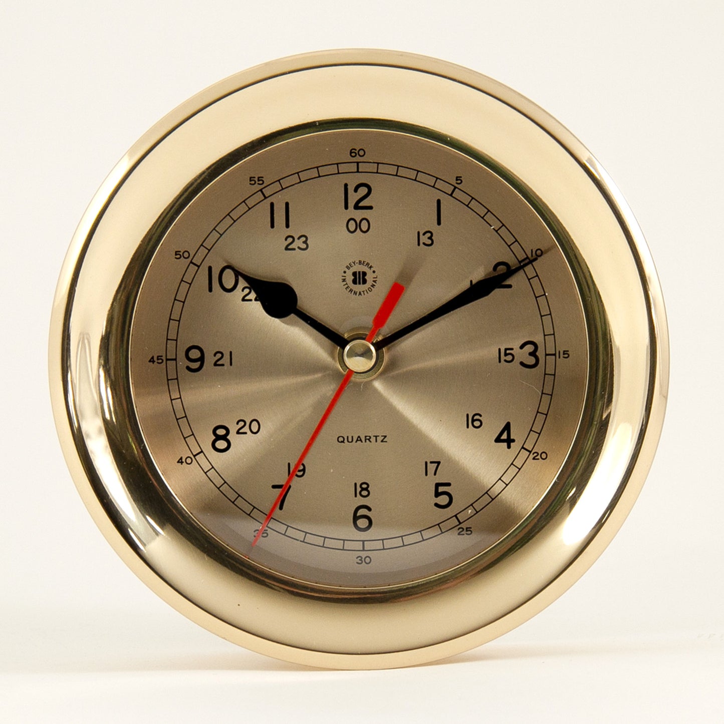 Occasion Gallery Gold Color Lacquered Brass Round Quartz Clock with Beveled Glass. 6.25 L x 2.5 W x H in.