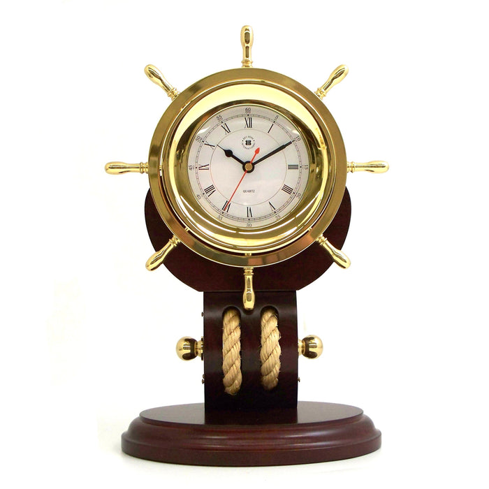 Occasion Gallery Teakwood/Gold Color Lacquered Brass Ships Wheel Quartz Clock with Beveled Glass and Fisherman's Rope on Solid Teakwood Base. 7 L x 5 W x 12 H in.