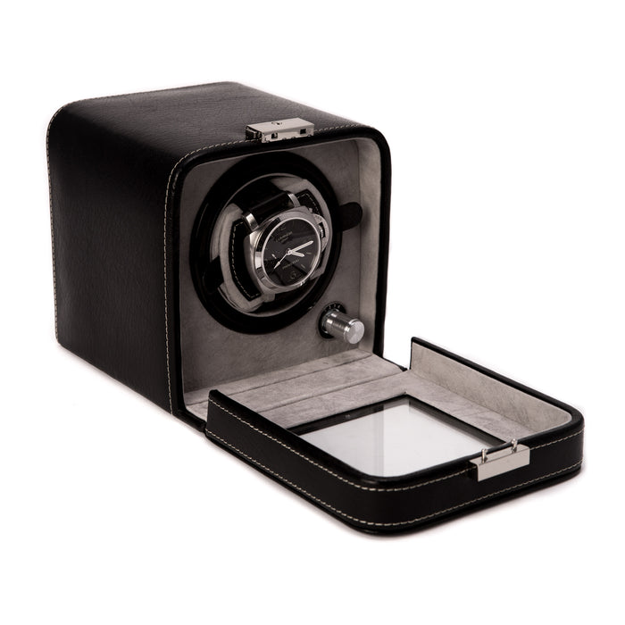 Occasion Gallery Black Leather Watch Winder, Glass Door & Locking Clasp. Four Rotation Modes Including Clockwise, Counter Clockwise & Alt. Directions. Rotates Approximately 3200 Times Per Day. Works on Both AC / DC Back Up Power 6 L x 5.25 W x 5.5 H in.