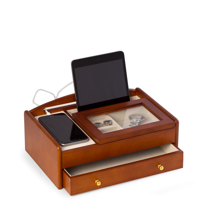 Occasion Gallery Brown Color Cherry Wood Valet Box. Storage Compartment w/ Glass Lid, Slot for Tablet Storage, Cell Phone Storage Tray, Opening on Back for Charging Cords, Storage Drawer & Velour Lined w/ Brass Accents. 11.25 L x 7.5 W x 4 H in.
