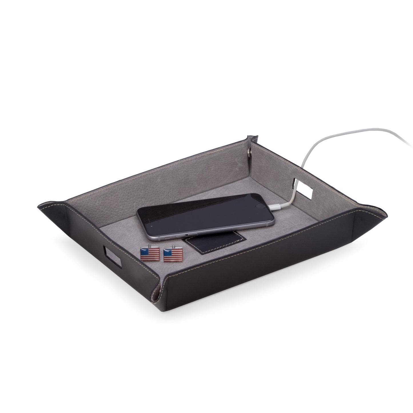 Occasion Gallery Black Color Black Leather Valet & Charging Station with Pig Skin Leather Lining. Continent Side Openings for Easy Charging Cord Pass-thru. 10 L x 7.75 W x 1.75 H in.