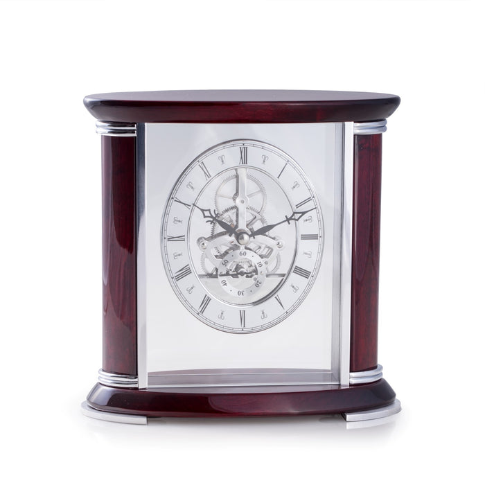 Occasion Gallery Rosewood/Silver Color "Luxemburg", Lacquered "Rosewood" and Stainless Steel Accents Quartz Clock with Skelton Movement. 8 L x 3.75 W x 7.75 H in.