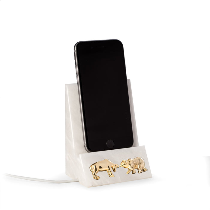 Occasion Gallery WHITE Color White Marble Desktop Phone / Tablet Cradle with a Pass-thru Hole for Charging Cable. With Brass Bull and Bear Insignia.  3.25 L x 2.5 W x 4.5 H in.