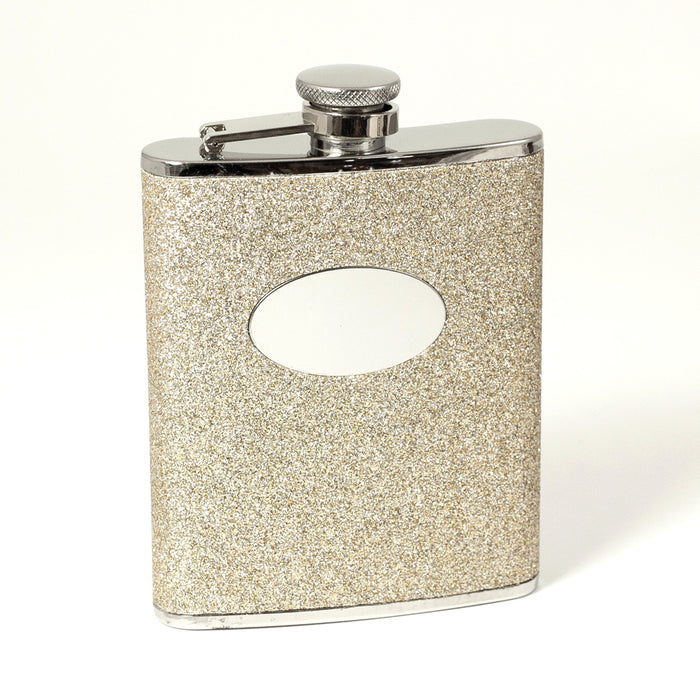 Occasion Gallery Gold Glitter/Silver Color 6 oz. Stainless Steel Gold Glitter Flask with Oval Medallion, Captive Cap and Durable Rubber Seal. 3.75 L x 0.75 W x 5.15 H in.