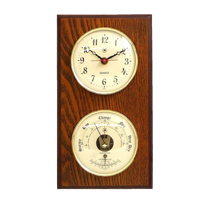 Occasion Gallery Oak Wood Color Quartz Clock and Barometer with Thermometer on Oak Wood with Brass Bezel. Wall Mounts Vertically or Horizontally. 6 L x 2 W x 11 H in.