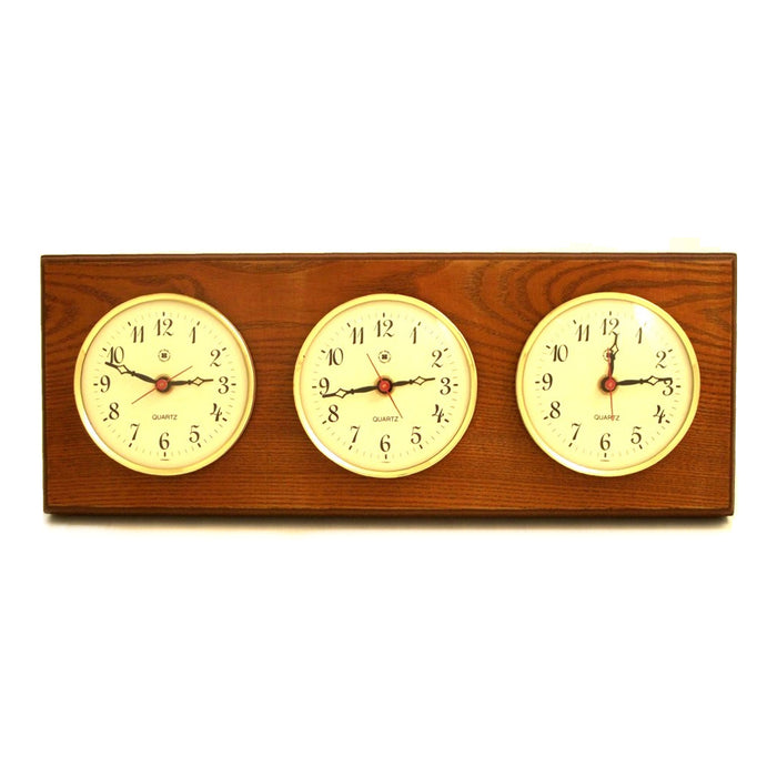 Occasion Gallery Oak Wood Color Triple Quartz Clock on Oak Wood with Brass Bezel. Wall Mounts Vertically or Horizontally. 6 L x 2 W x 16 H in.