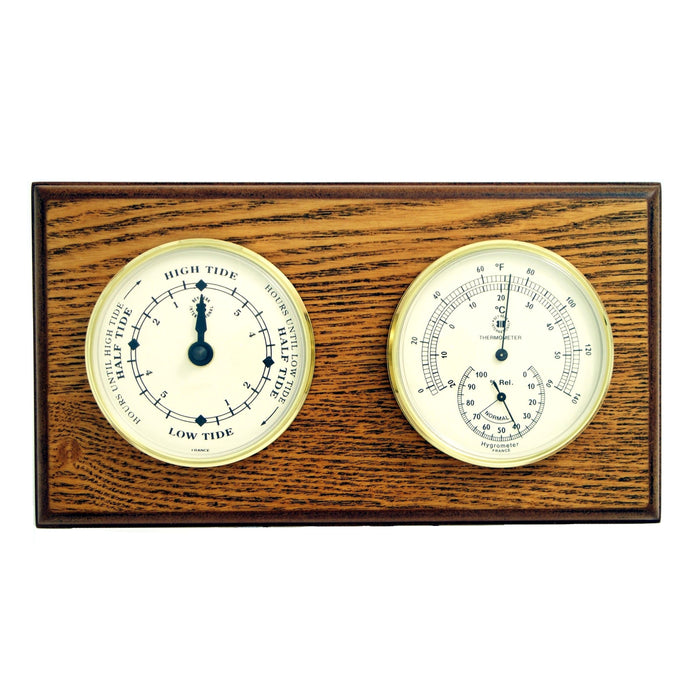 Occasion Gallery Oak Wood Color Tide Clock and Thermometer with Hygrometer on Oak Wood with Brass Bezel. Wall Mounts Vertically or Horizontally. 6 L x 2 W x 11 H in.